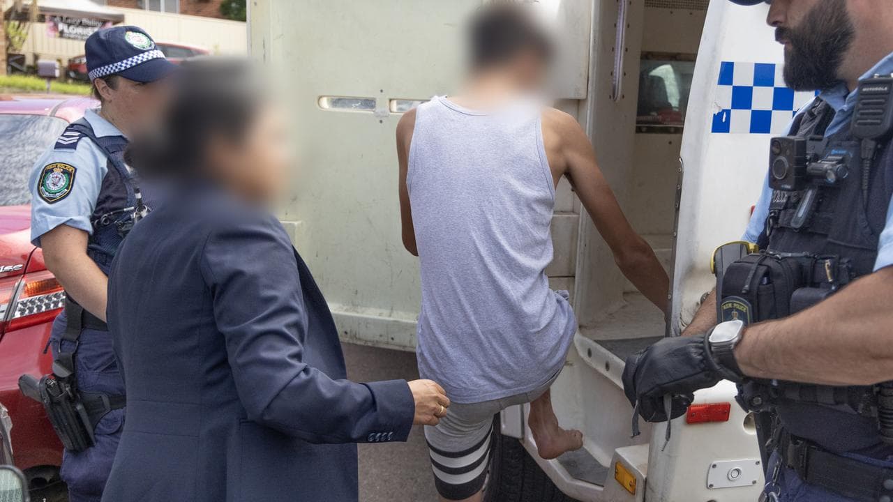 Police arrest a person after executing search warrants in Sydney