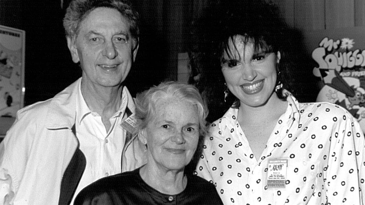 Mr Squiggle's creators and their daughter.