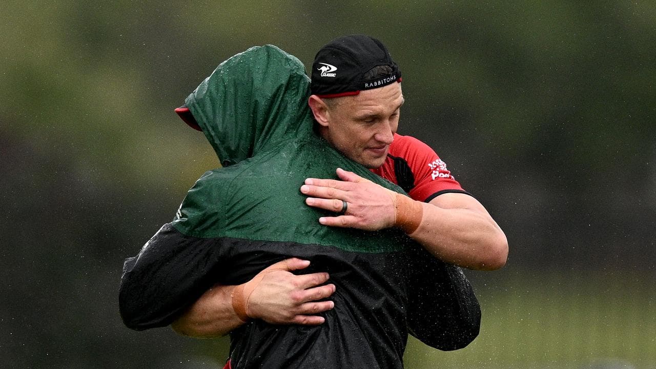 Jake Wighton hugs outgoing Souths coach Jason Demetriou. 