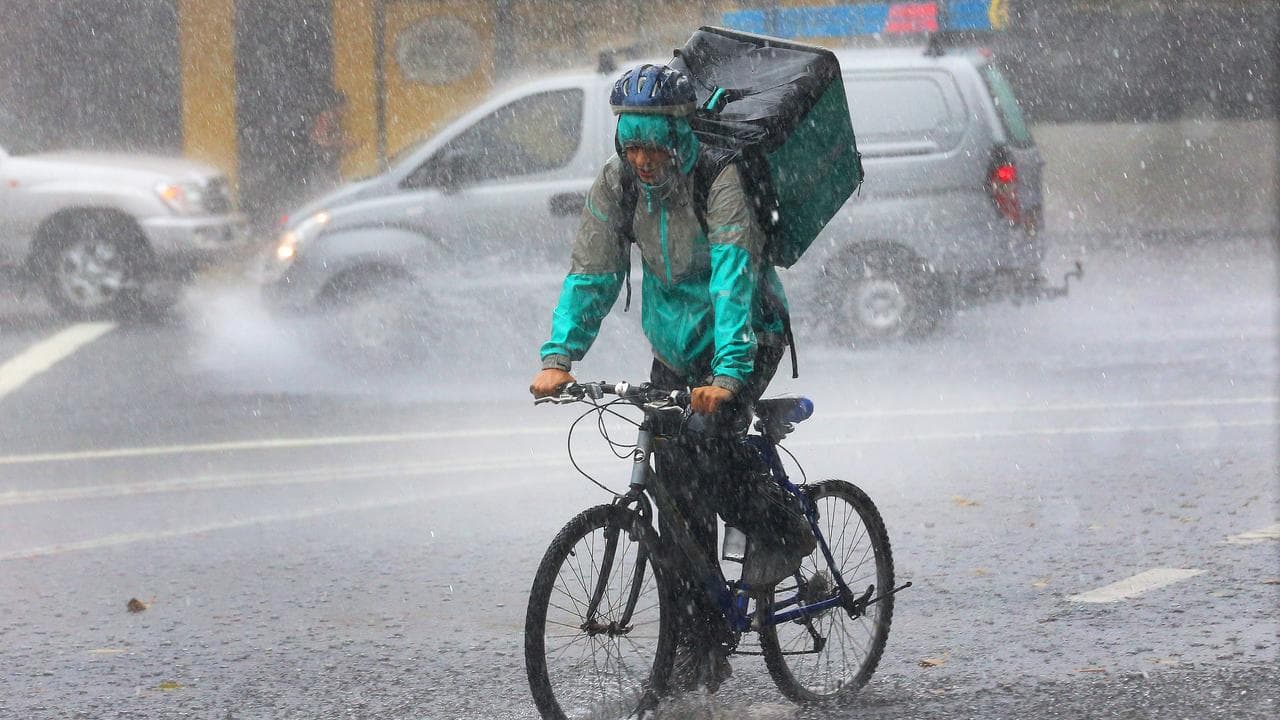 A cyclist in heavy rain