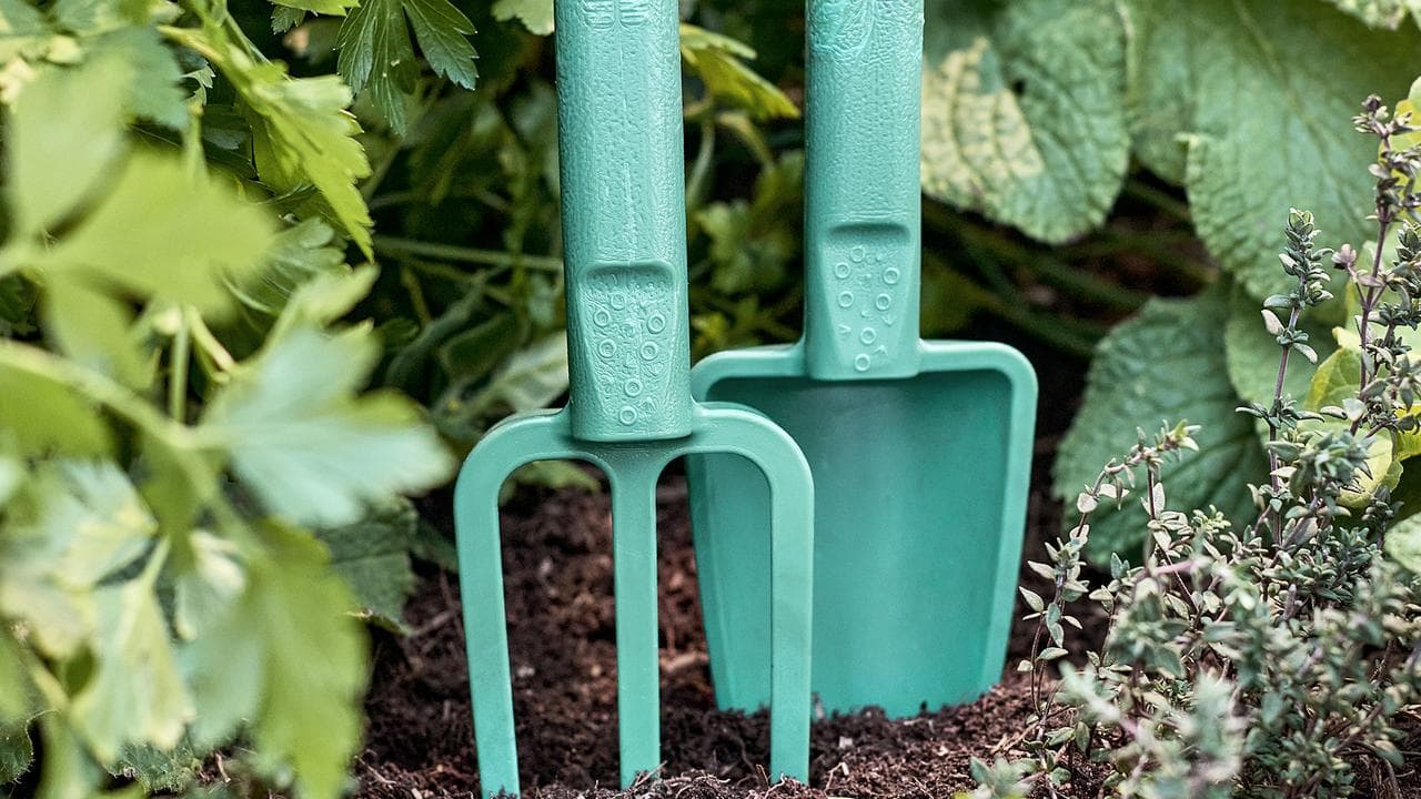 Garden tools made from recycled plastic bottle tops.