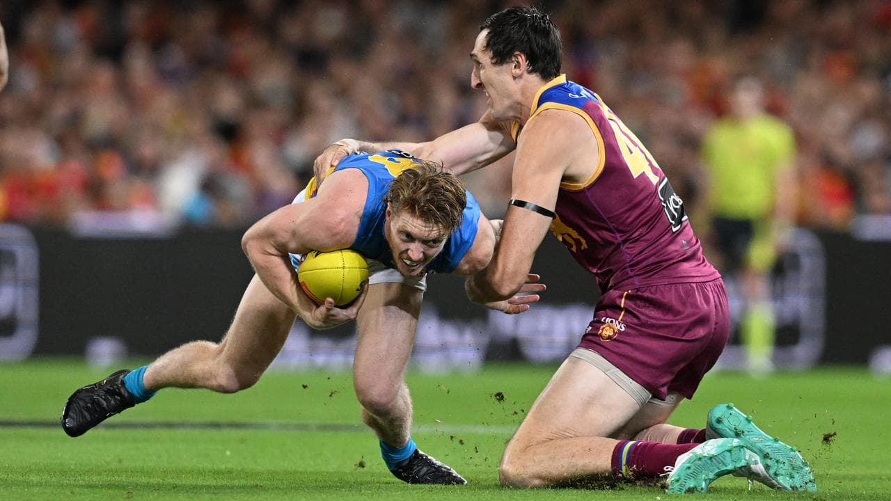 Oscar McInerney tackles Matt Rowell.