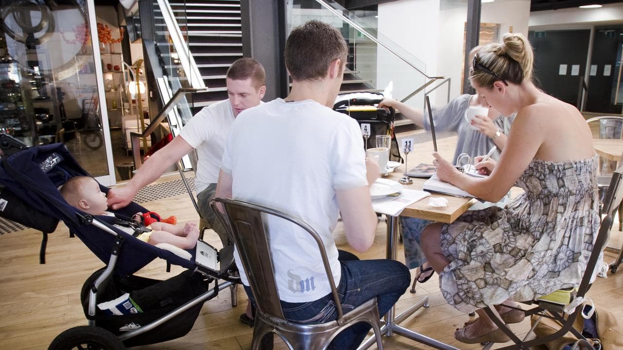 Parents with babies at a cafe