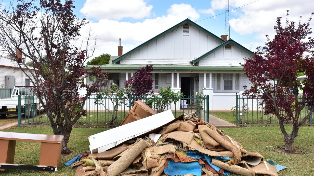 Flood damaged goods outside a house in Forbes.