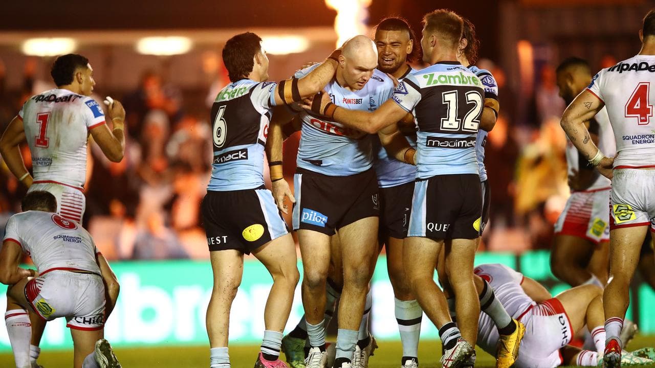 Cronulla players celebrate a Thomas Hazelton try.