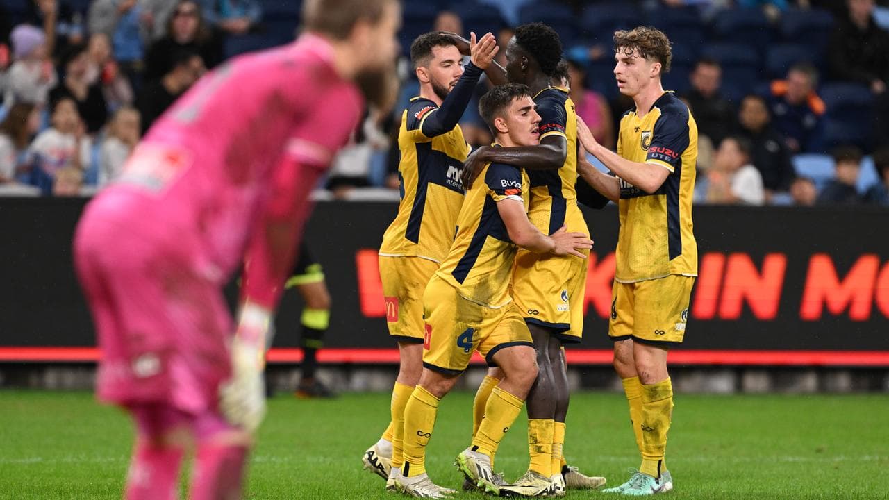 Josh Nisbet (4) celebrates his first-half equaliser for Central Coast.