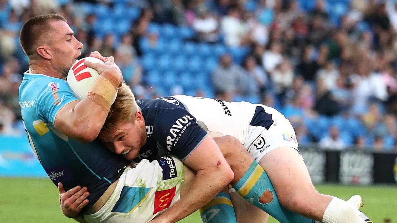 Kieran Foran is tackled by Tom Dearden.