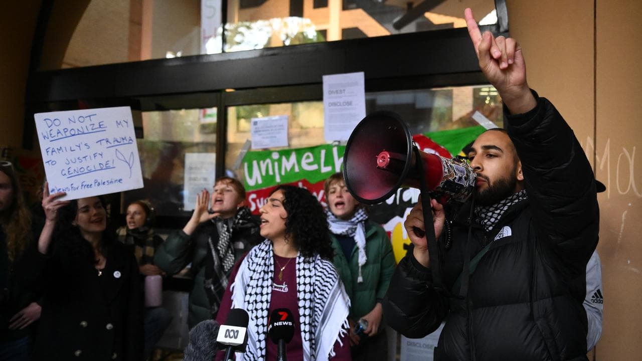 Student chant at a pro-Palestine camp at the University of Melbourne