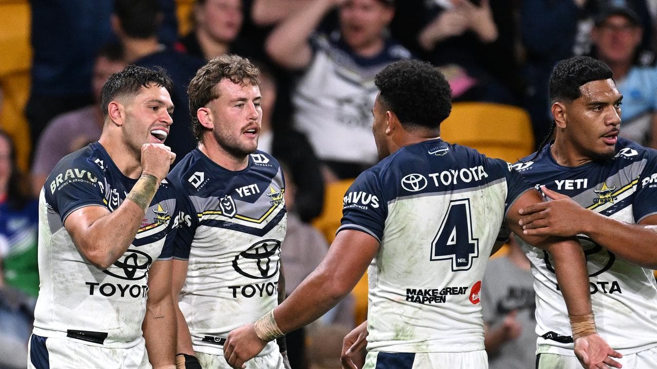 North Queensland's Braidon Burns (left).