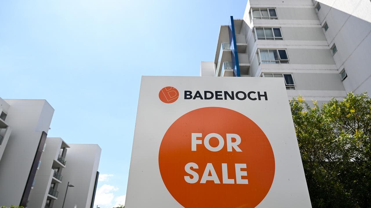 A ‘For Sale’ sign is seen outside an apartment block in Canberra