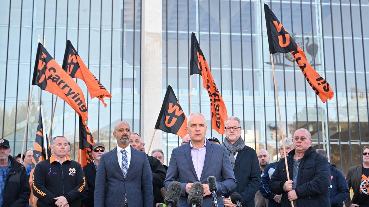 Michael Kaine and Qantas workers outside the High Court (file image)