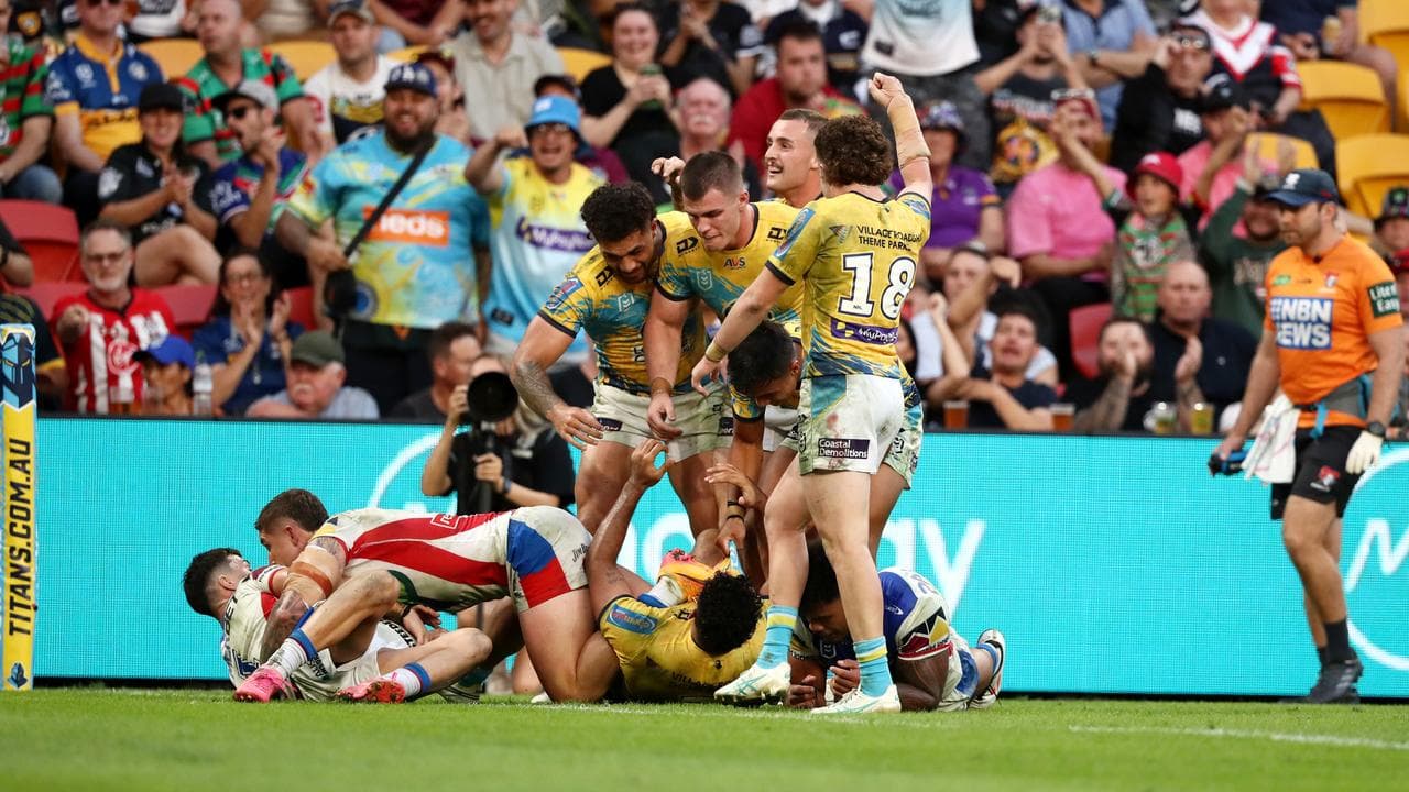 Titans players claim the try after Brian Kelly crossed the line.