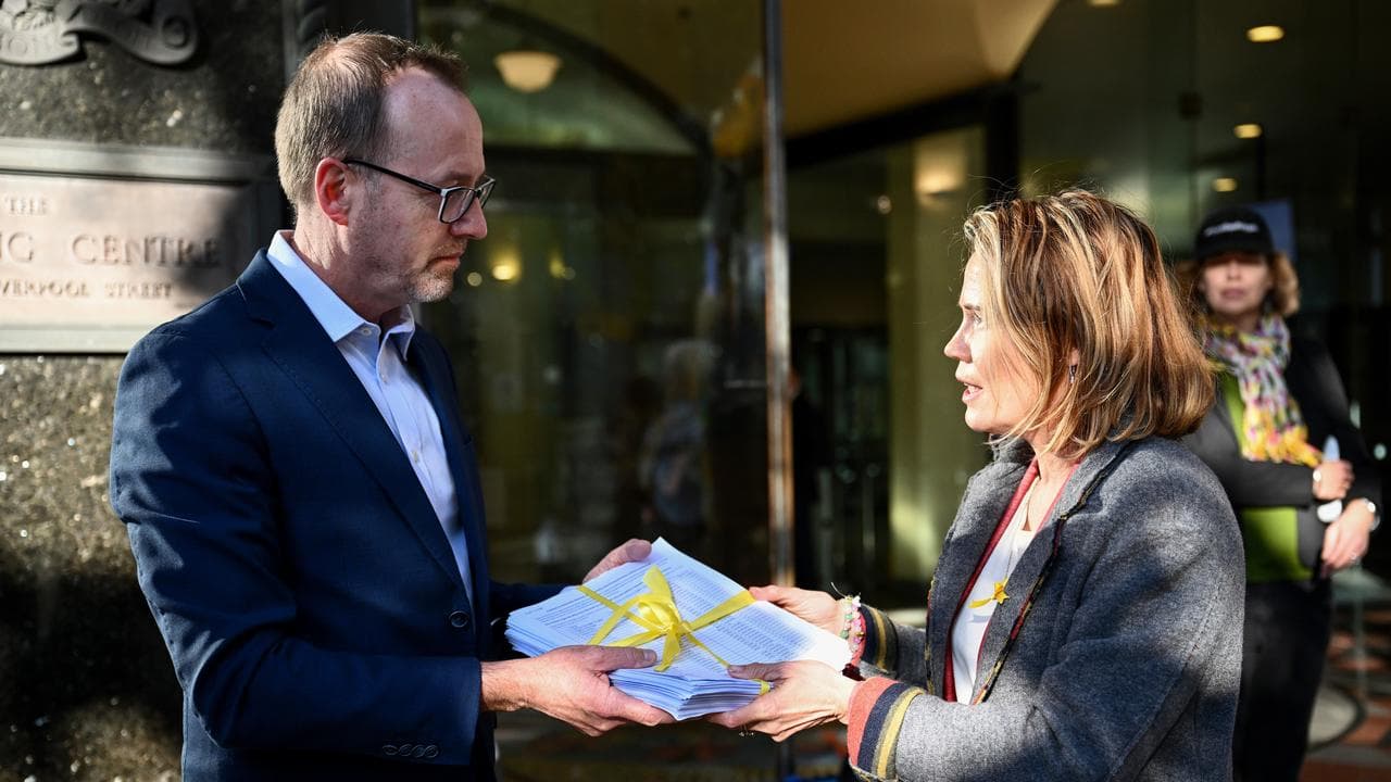 Senator David Shoebridge accepts a petition to free Daniel Duggan