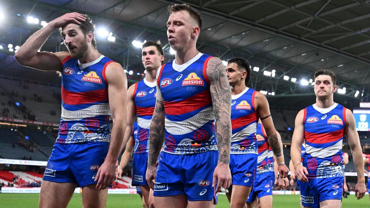 Bulldog players leave the field.