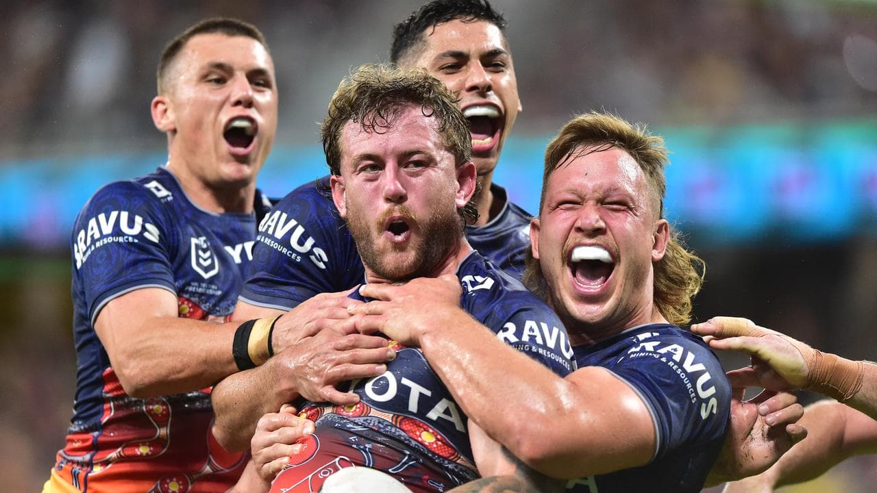 Cowboys players celebrate a try.