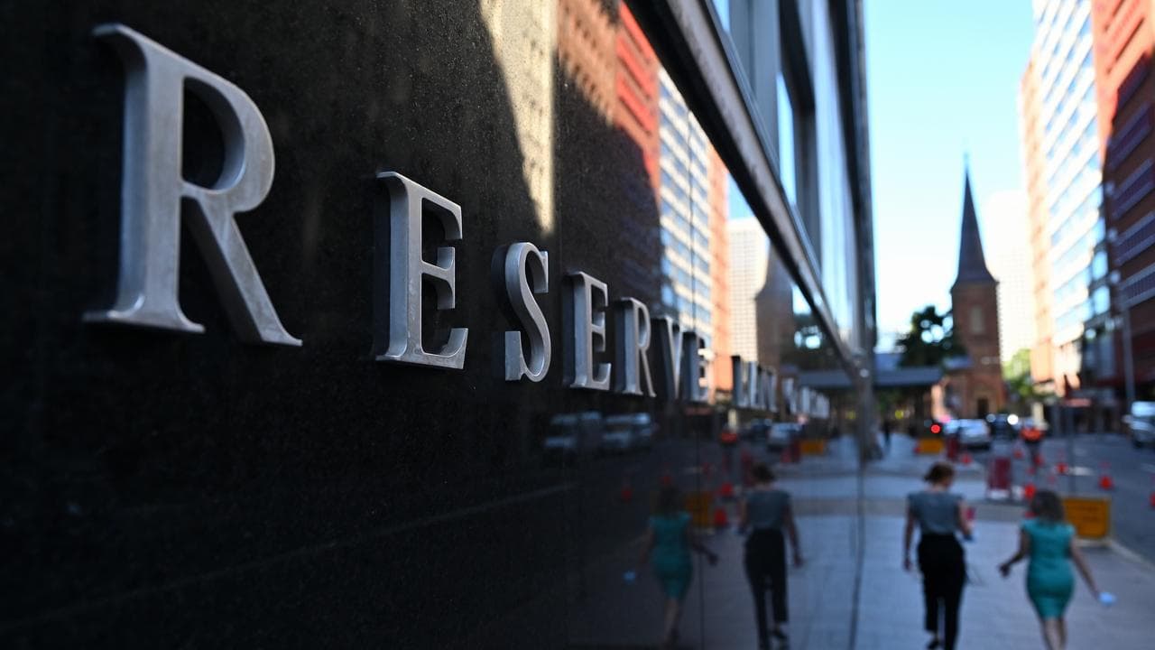 People walk past the Reserve Bank of Australia in Sydney
