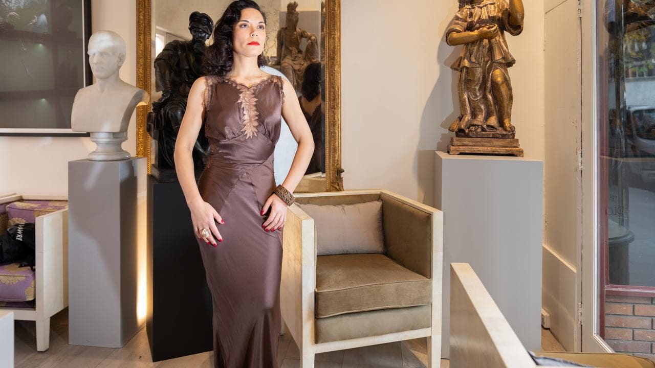 A woman models a dress.