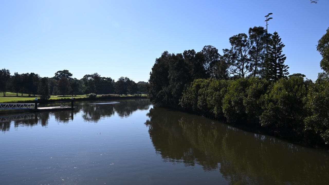A crime scene has been established by the Cooks River in Sydney