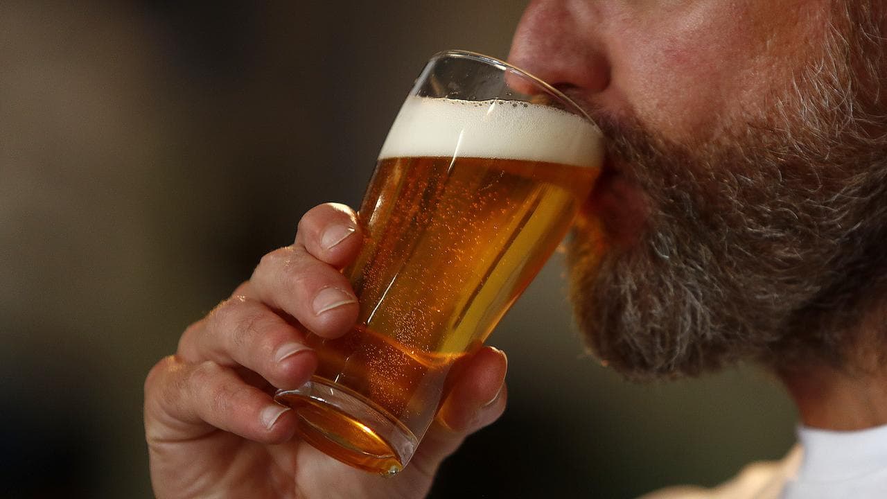A man drinking a beer