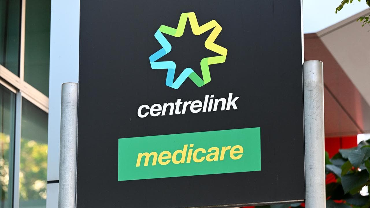 A sign with the words Centrelink and Medicare