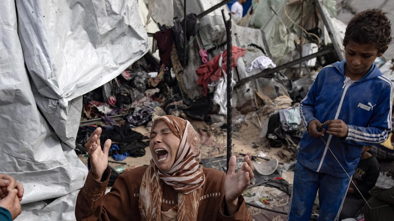 A Palestinian woman reacts after an Israeli army operation in Rafah
