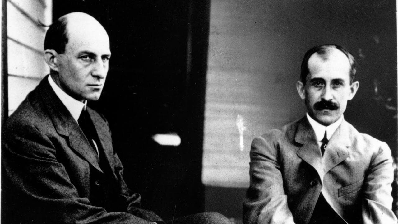 Orville and Wilbur Wright relaxing outside their home in Ohio, 1910