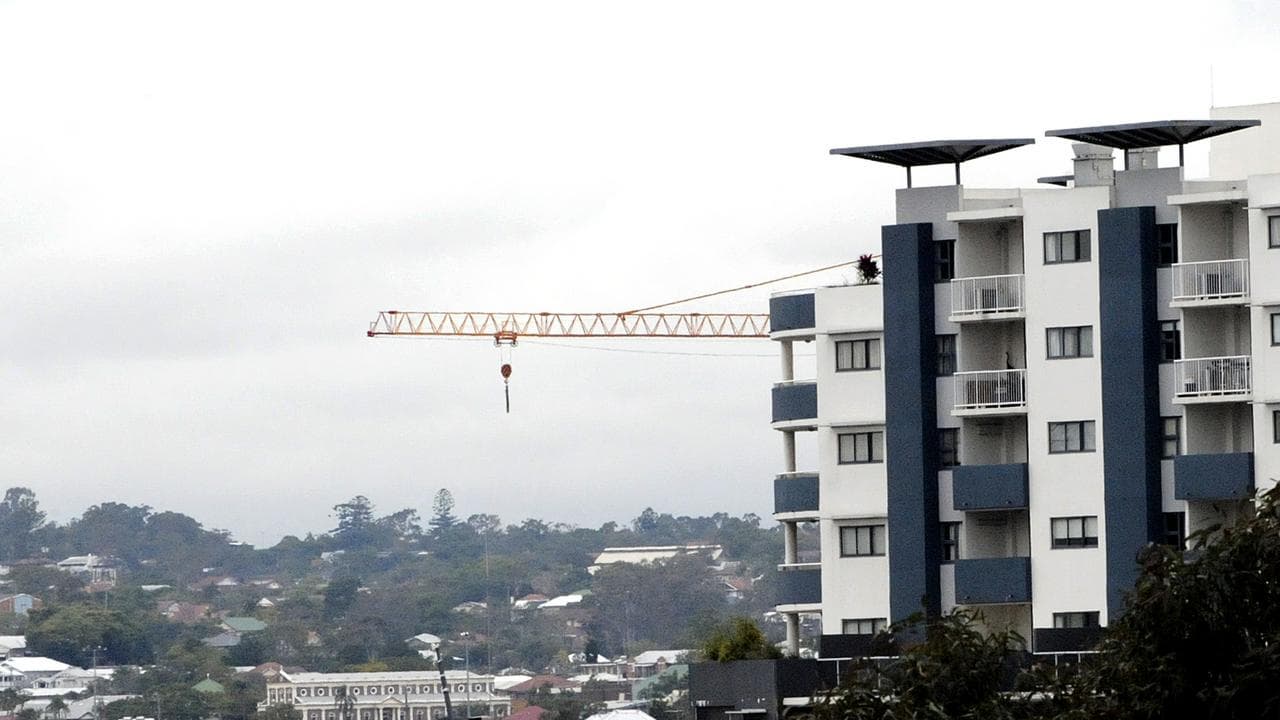 Construction crane and housing