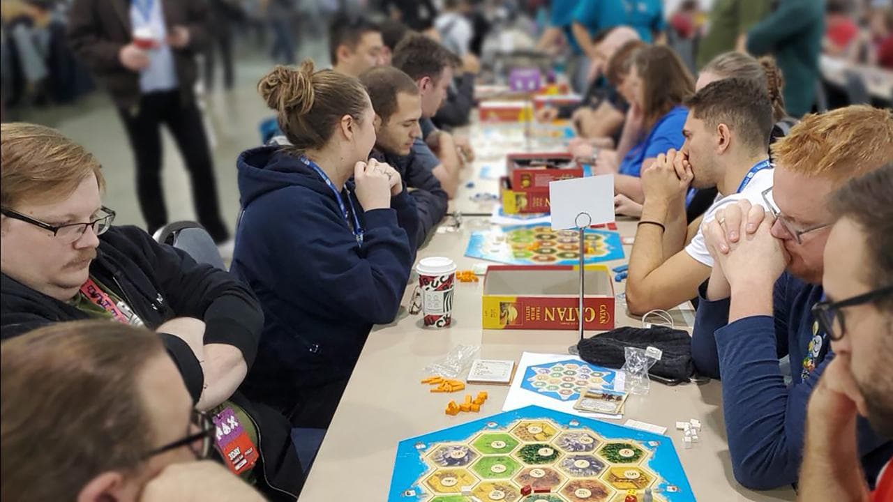 People playing Catan
