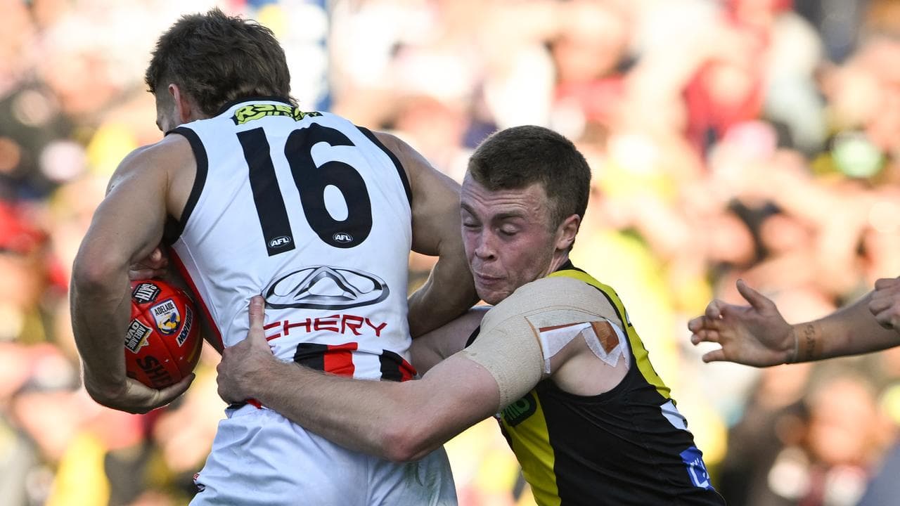 Richmond's Tom Brown tackles St Kilda's Dan Butler.