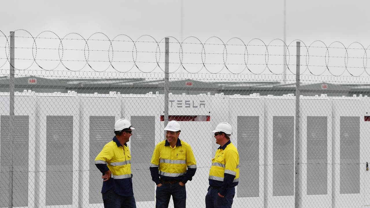 Construction workers at Tesla's 100 megawatt lithium-ion battery in SA