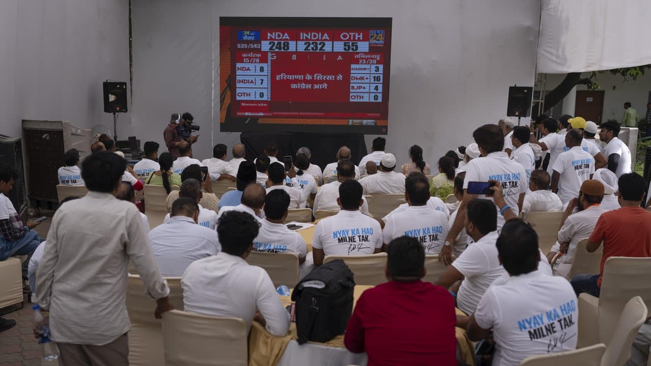 Congress party supporters watch proceedings of counting of votes