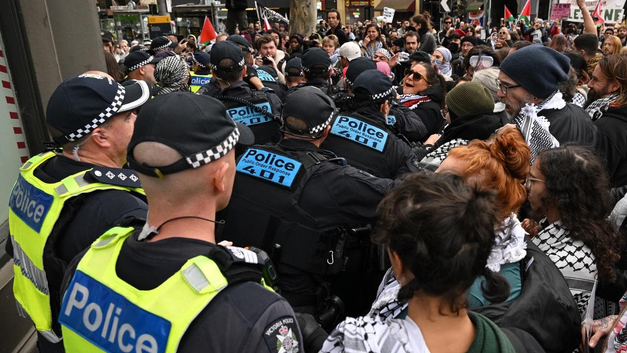 Protesters scuffle with police at a pro-Palestine rally in Melbourne