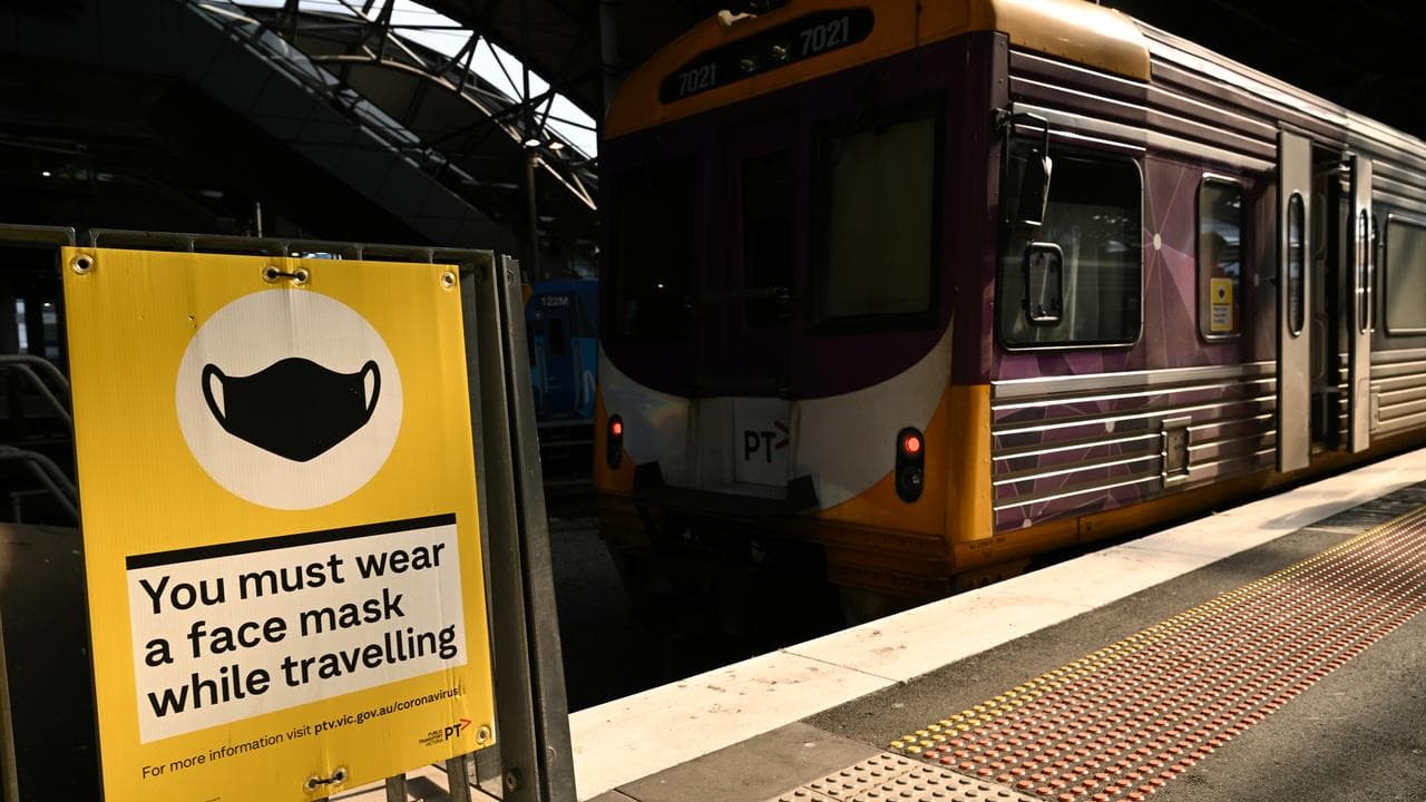 Signage reminding train passengers to wear masks, January 2022.
