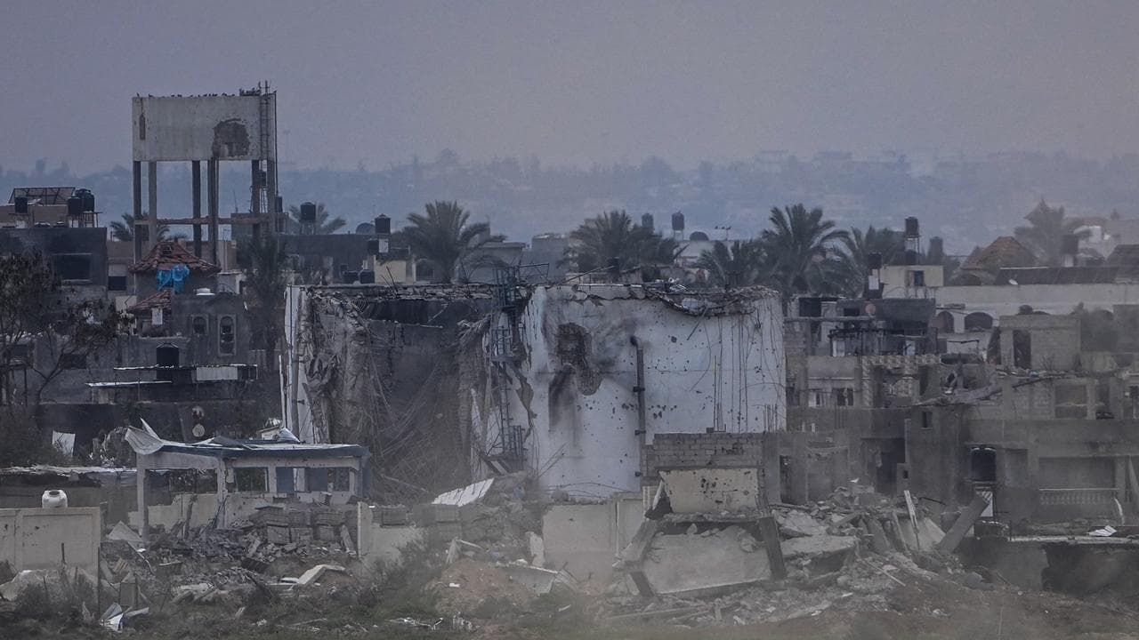 Israeli forces and damaged buildings in Gaza