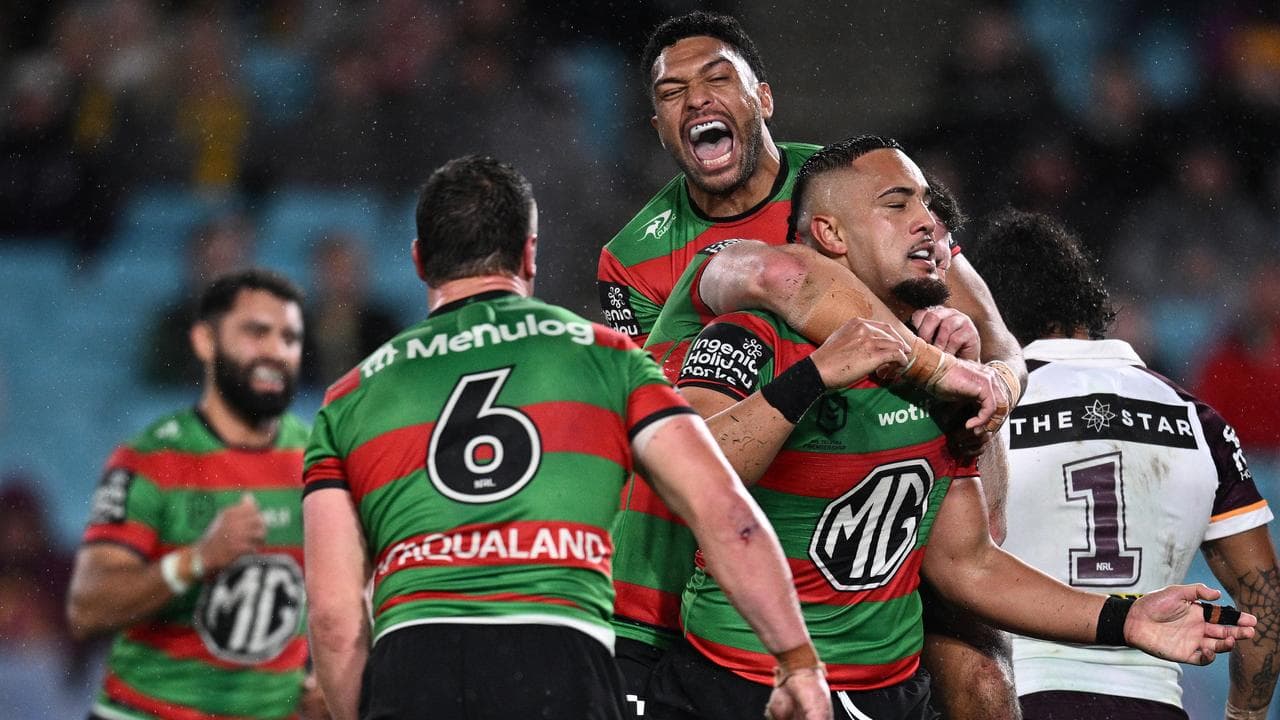 Souths players celebrate.