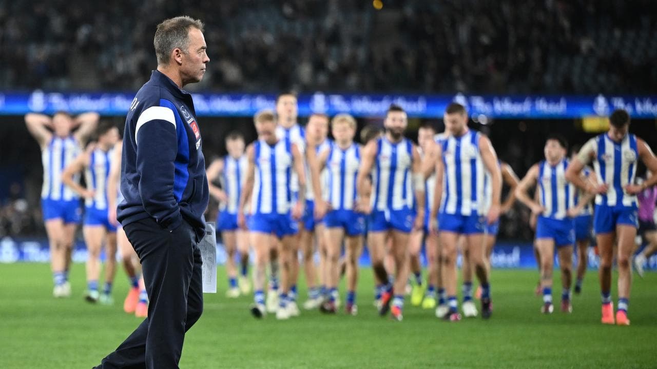 North Melbourne players leave the field.