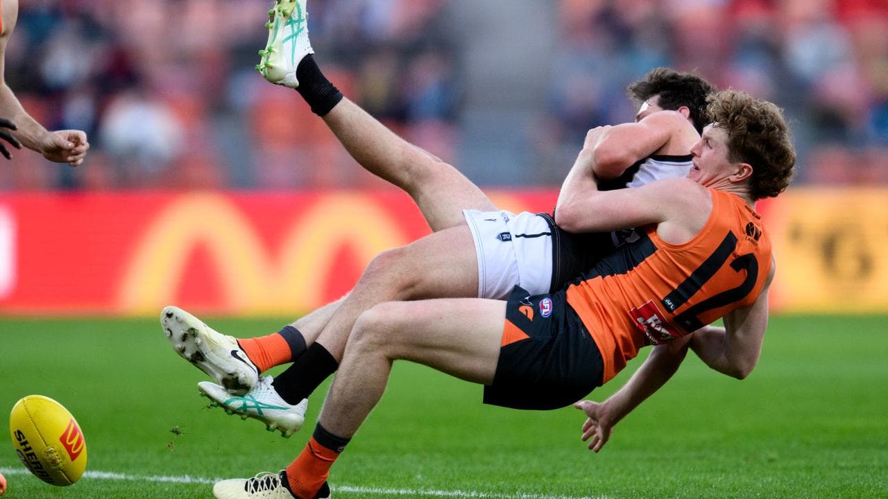 Tom Green tackles Jed McEntee.