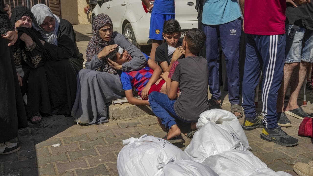 Palestinians mourn relatives killed in an Israeli bombardment