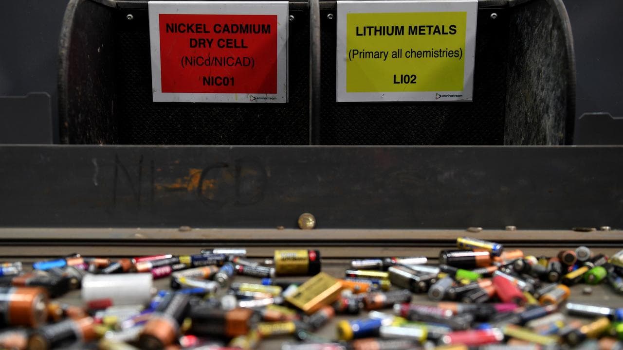 Batteries on a recycling conveyer belt