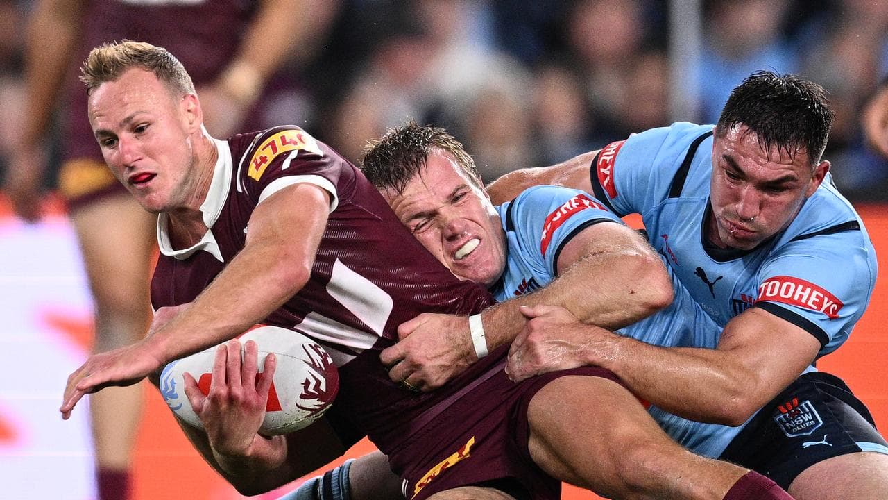 Daly Cherry-Evans is tackled. 