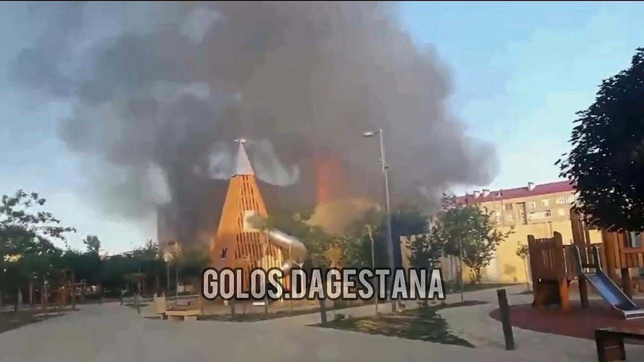 Smoke rises following an attack on a church in Makhachkala