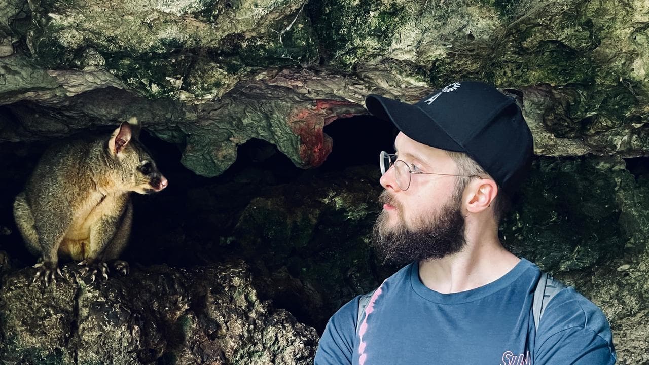Tom Jameson with a possum