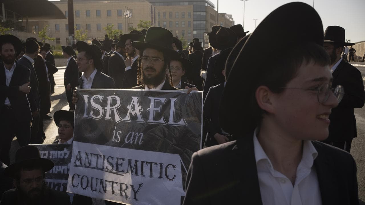 Ultra-Orthodox Jewish men block protest in Jerusalem