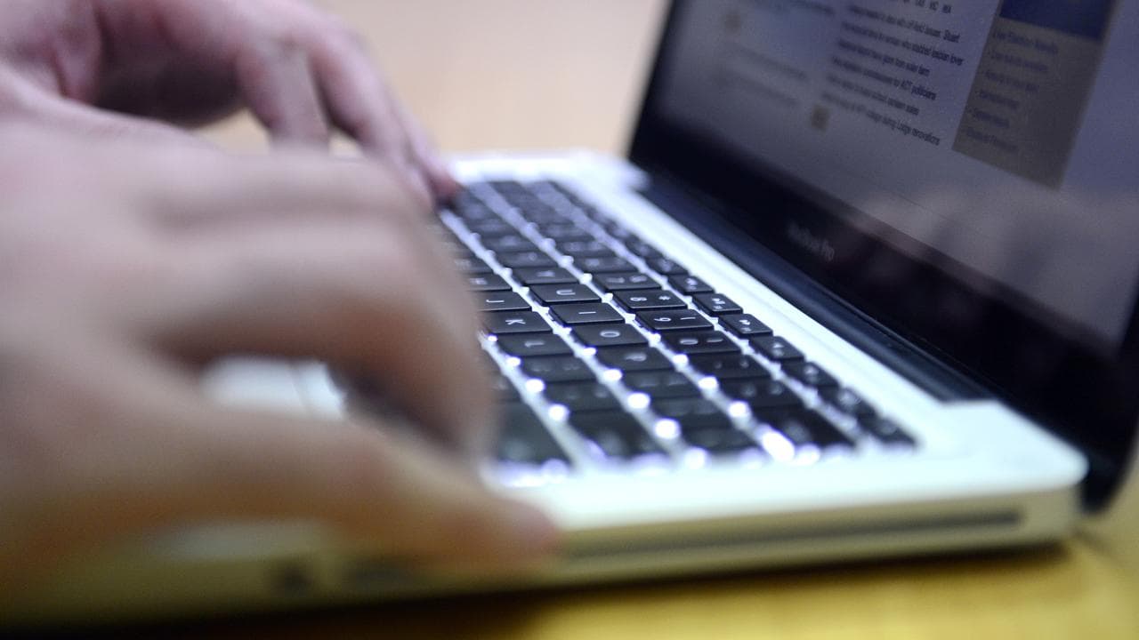 A man uses a laptop computer