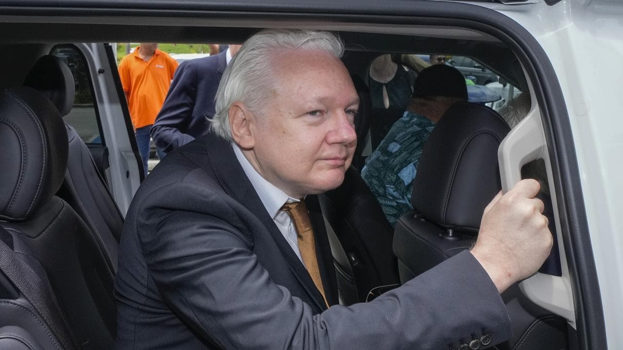 Julian Assange leaves court in Saipan