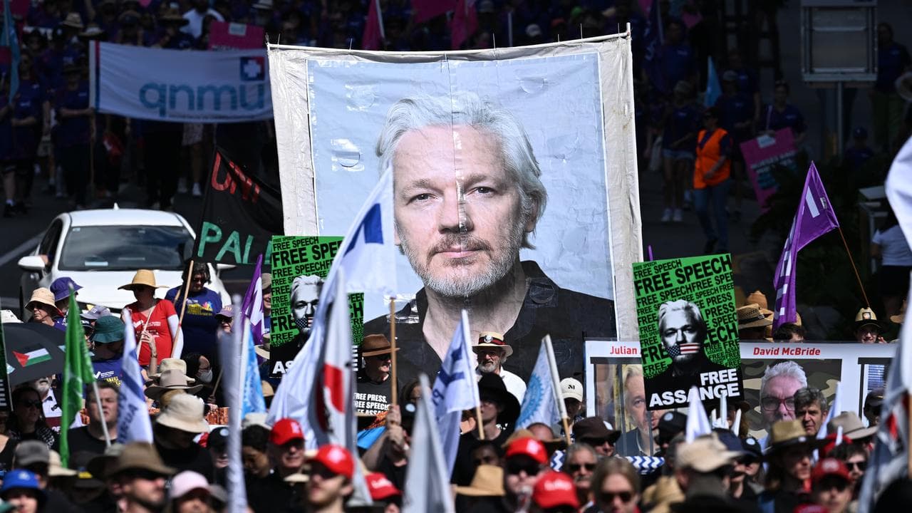 Portrait of Julian Assange carried during a protest