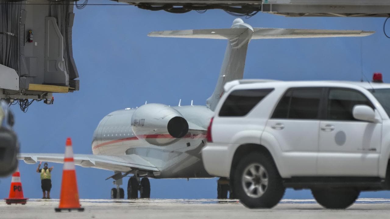 A plane carrying Julian Assange prepares to fly to Australia.