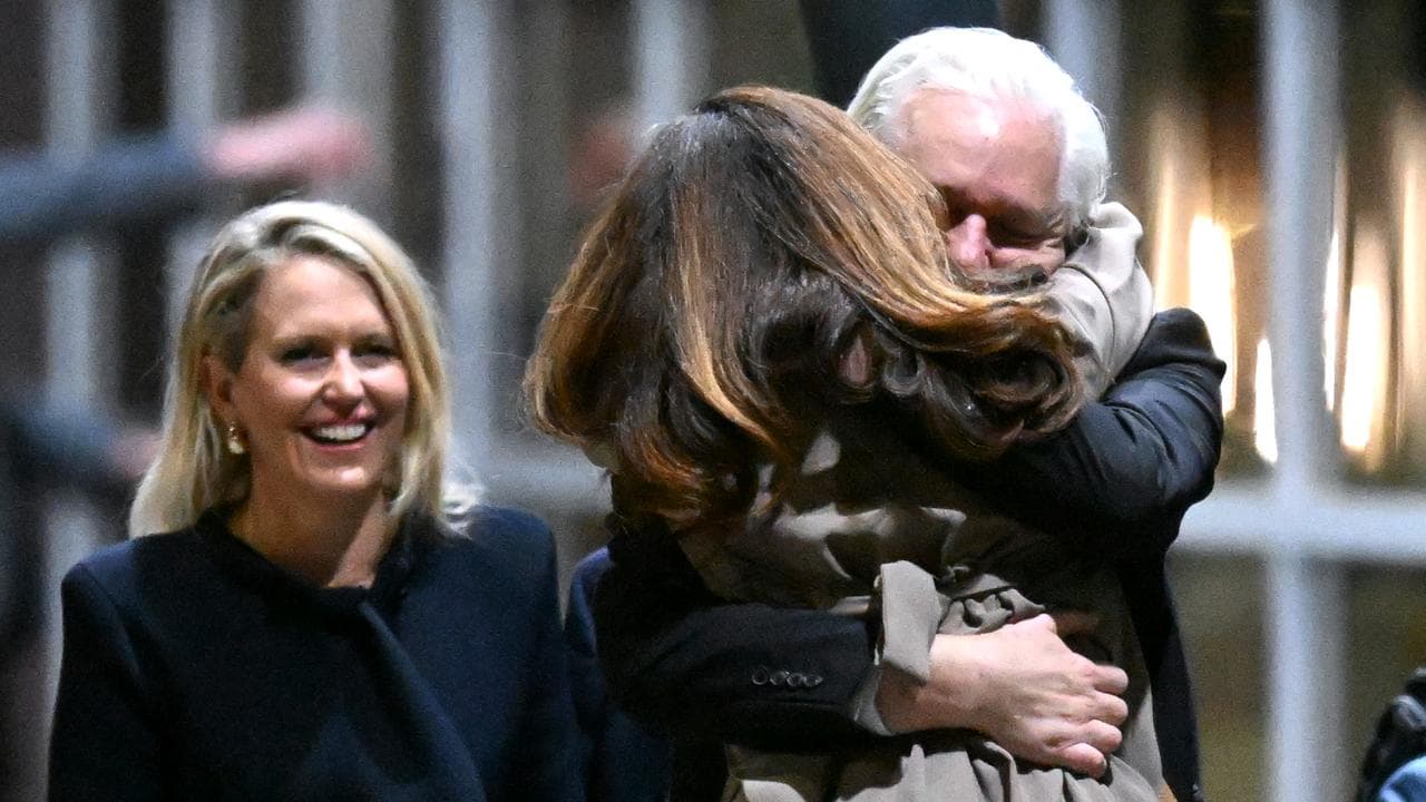 Julian Assange hugs his wife Stella