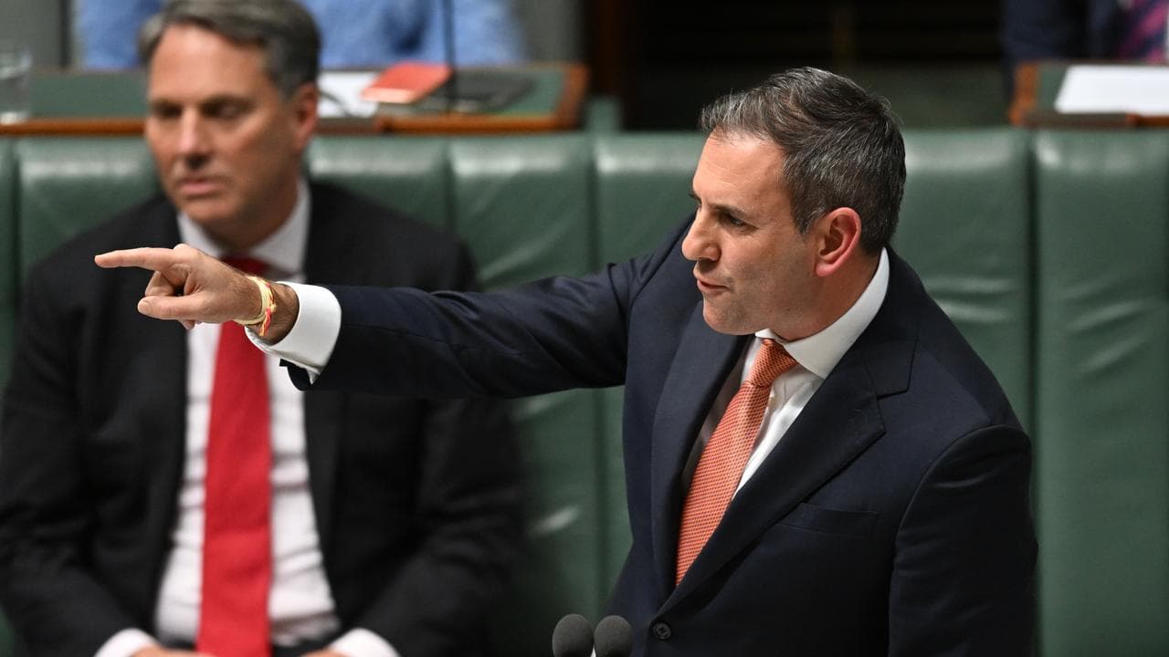 Treasurer Jim Chalmers gestures during question time in parliament