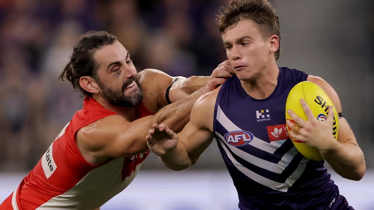 Sydney's Brodie Grundy (left) and Fremantle's Caleb Serong (right).